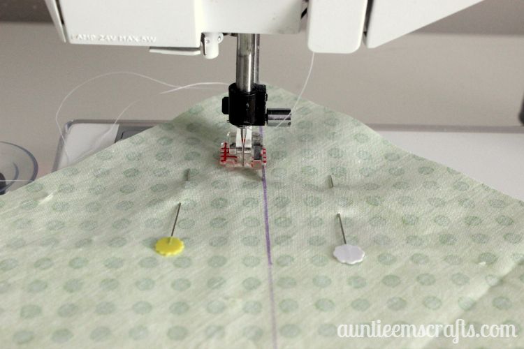 Rainbow Half Square Triangle Quilt. This rainbow HST (half square triangle) quilt came together in just one day.  You, too, can make one quickly with scraps or even a layer cake.| Auntie Em's Crafts