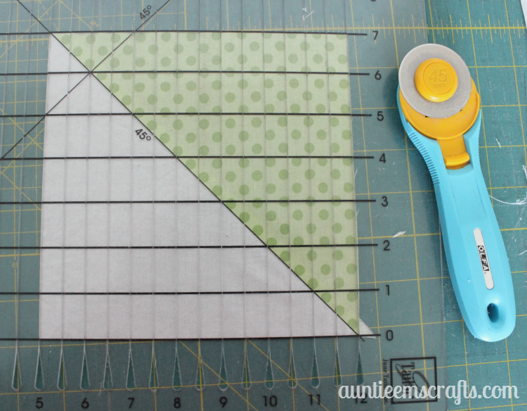 Rainbow Half Square Triangle Quilt. This rainbow HST (half square triangle) quilt came together in just one day.  You, too, can make one quickly with scraps or even a layer cake.| Auntie Em's Crafts